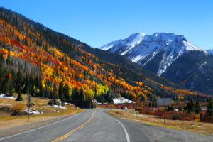 a road with mountains in the background